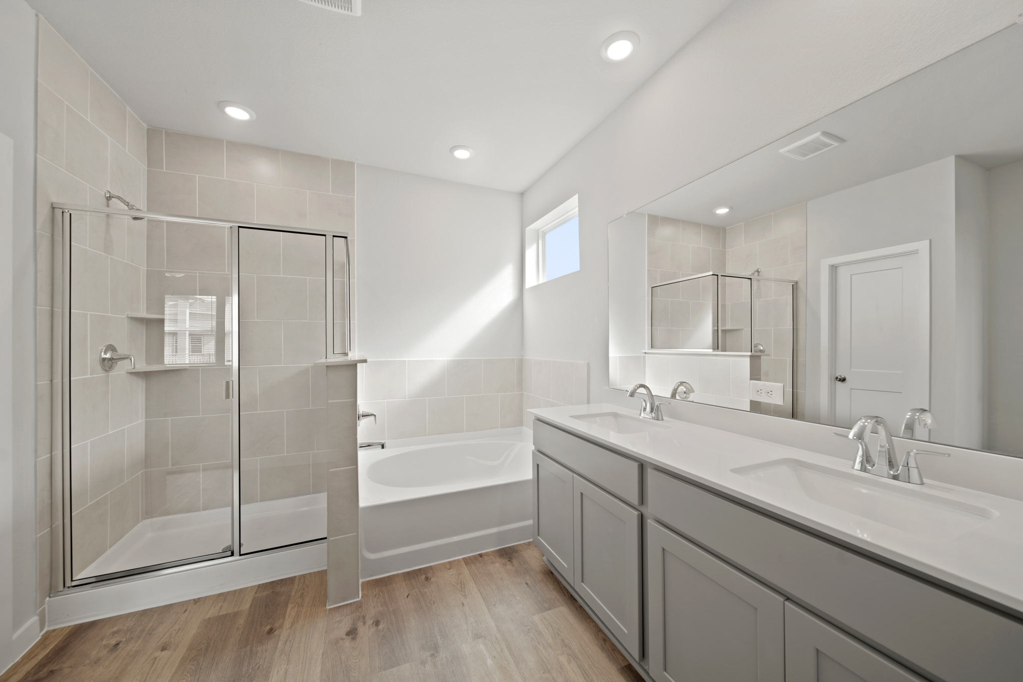 A bathroom with a glass shower.