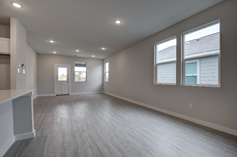 A large empty room with windows.