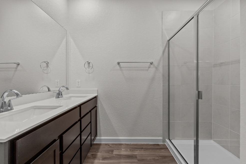 A bathroom with a glass shower.