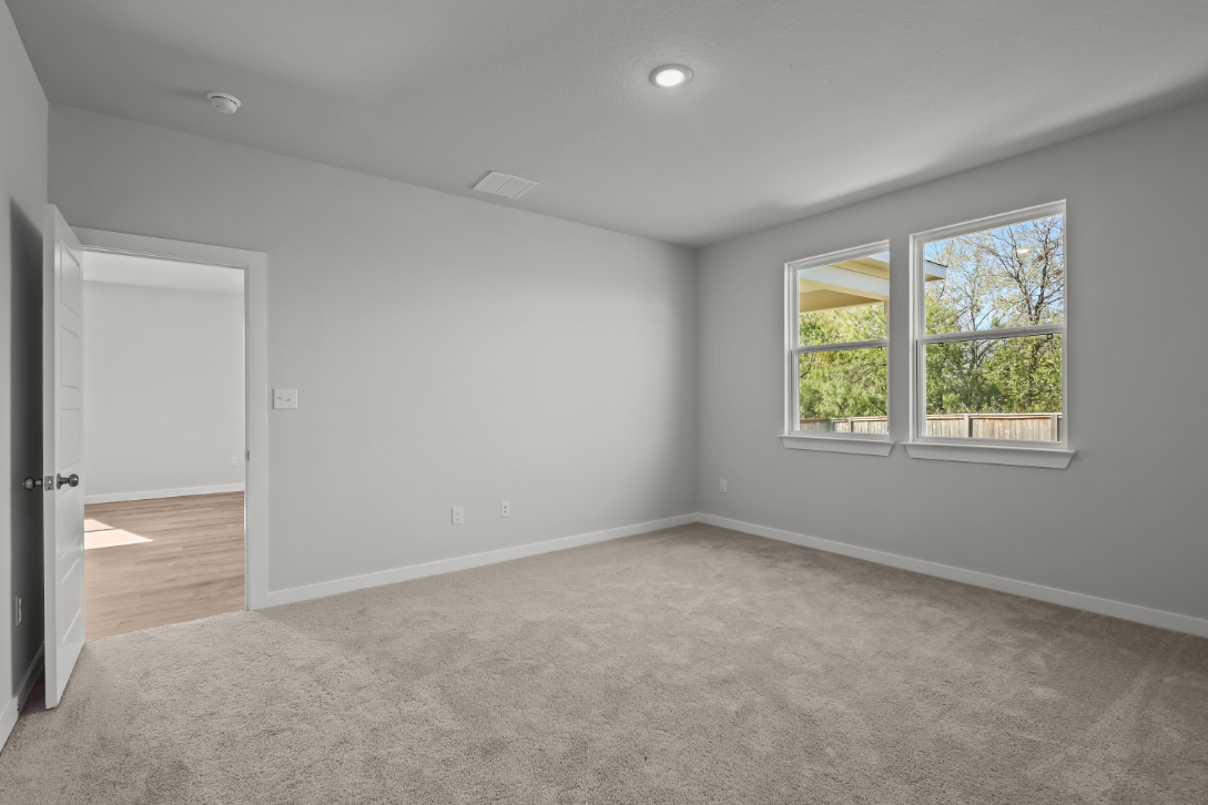 A room with a window and a door.