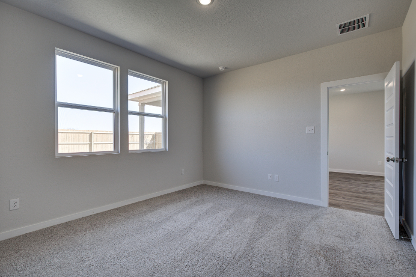 A room with a door and windows.