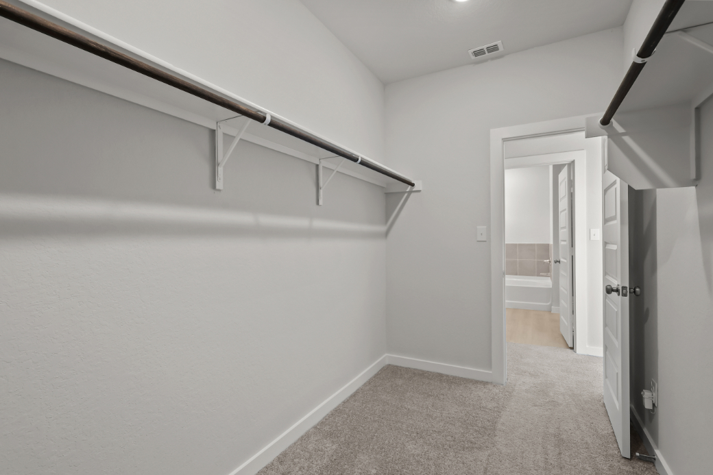 A hallway with white walls.