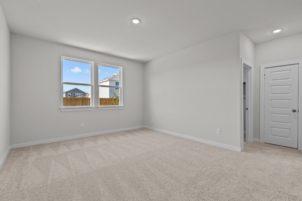 A room with a window and a door.