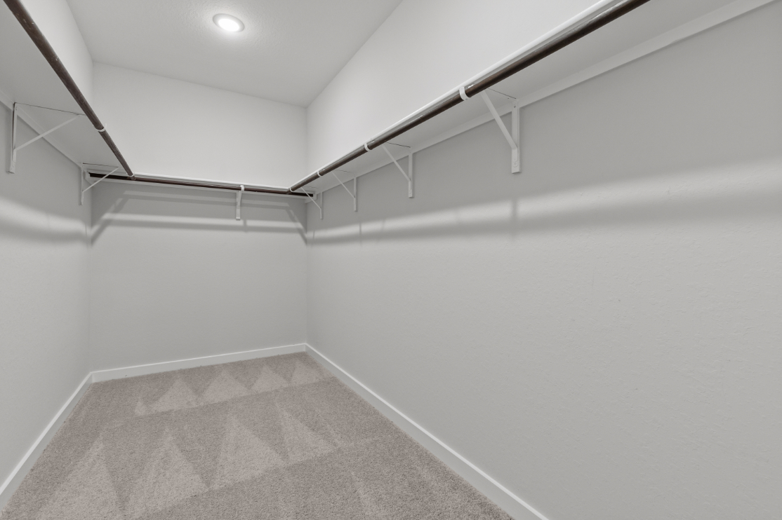 A white room with a tile floor.