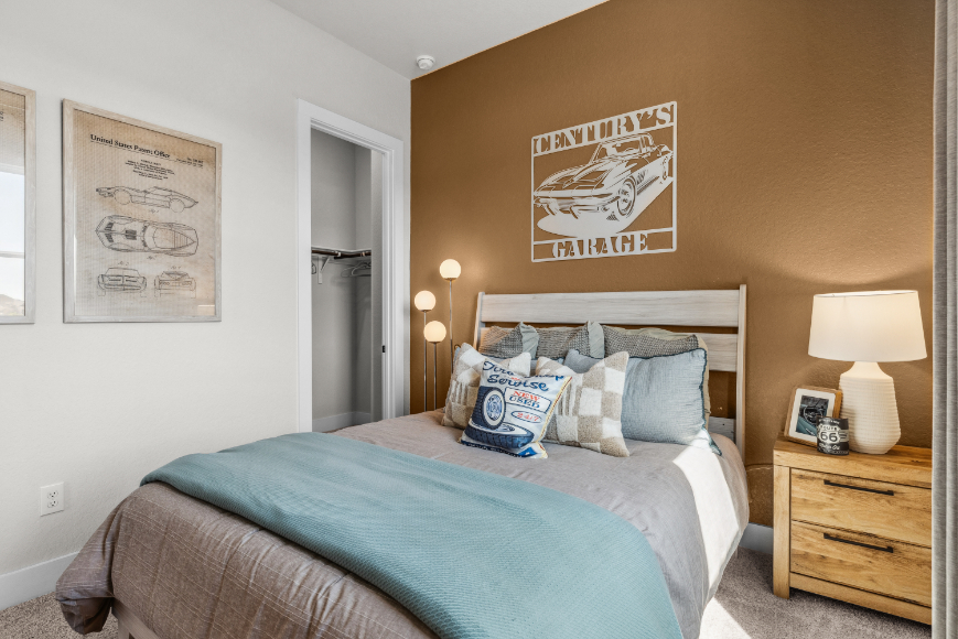 A bed with a poster on the wall.