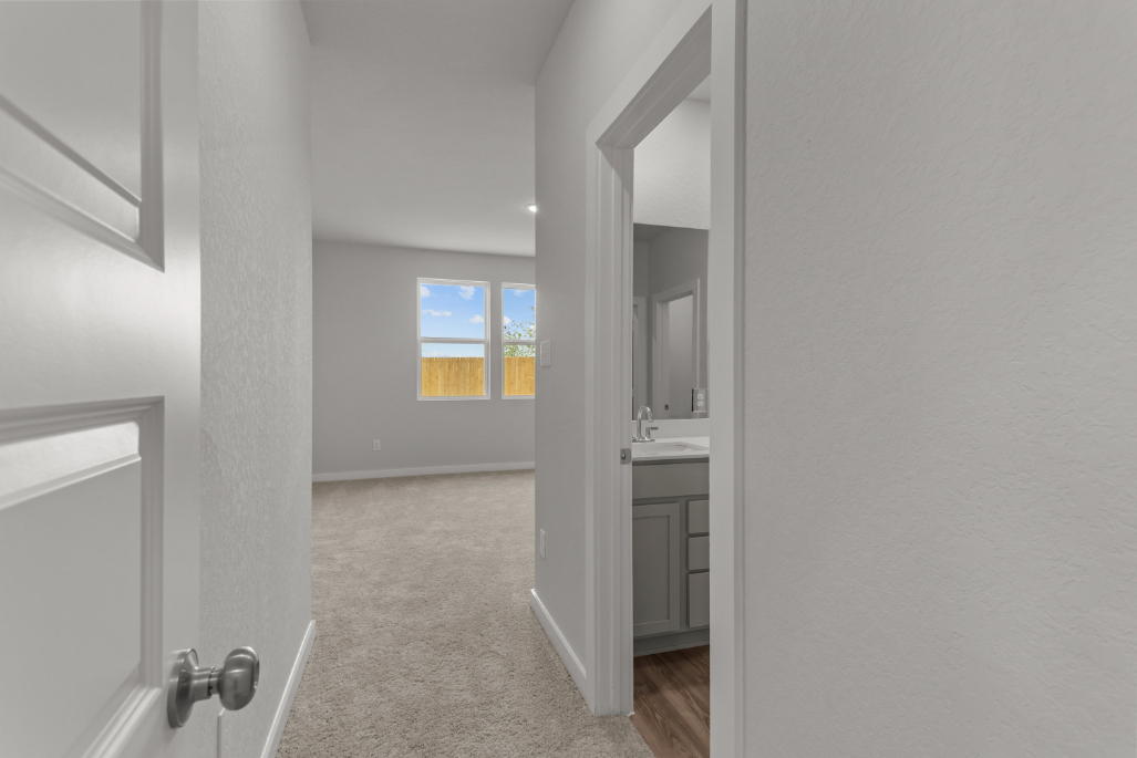 A bathroom with a sink and a mirror.