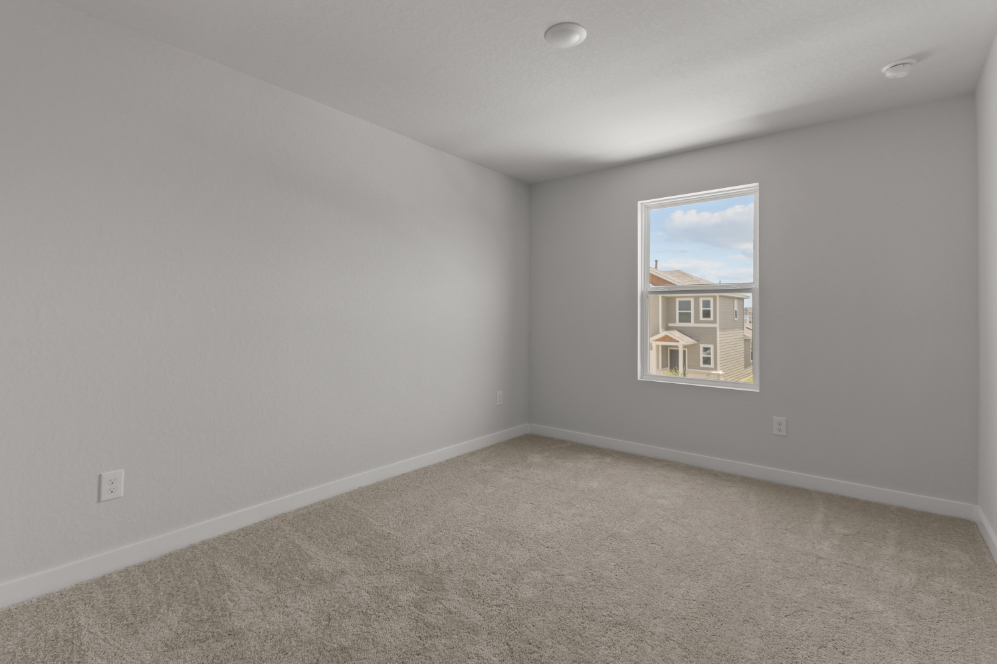 A room with a painting on the wall.