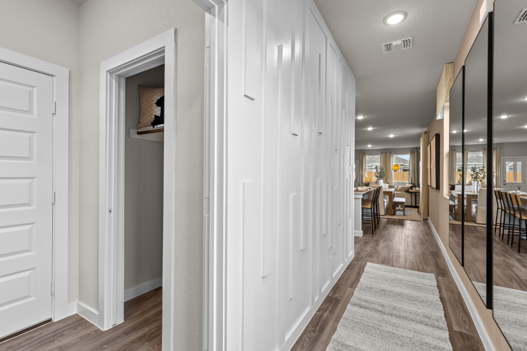 A hallway with white doors.