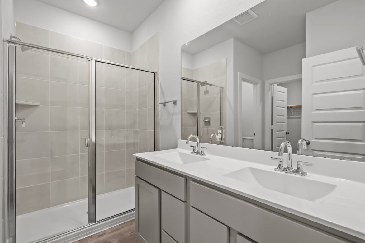 A bathroom with a glass shower.