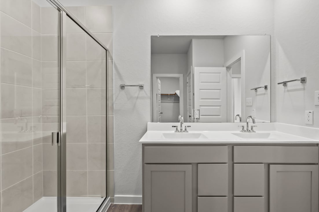 A bathroom with a glass shower.