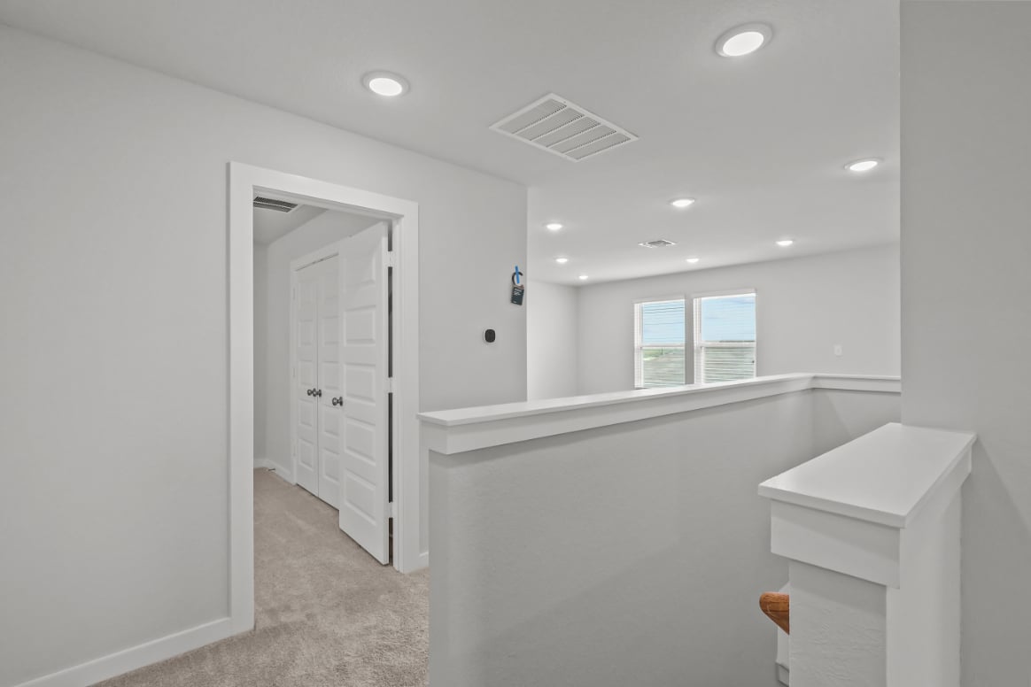 A bathroom with white walls.