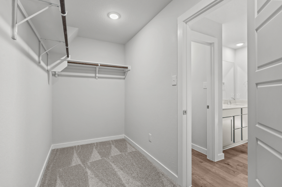 A bathroom with white walls.