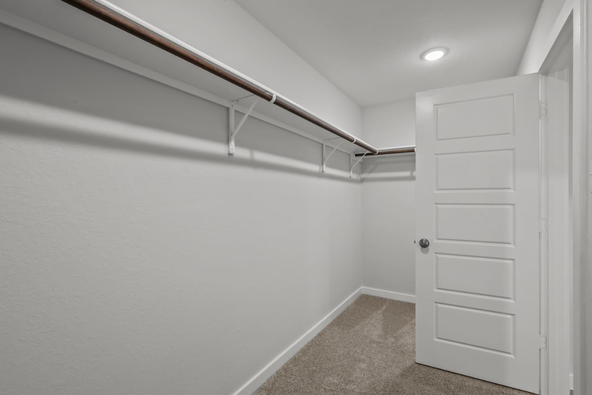 A white room with a white door.