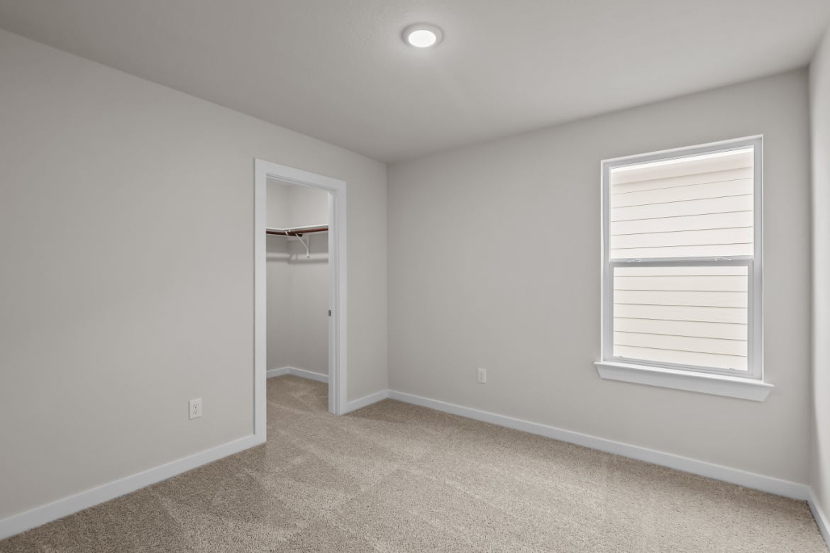 A room with a door and a window.