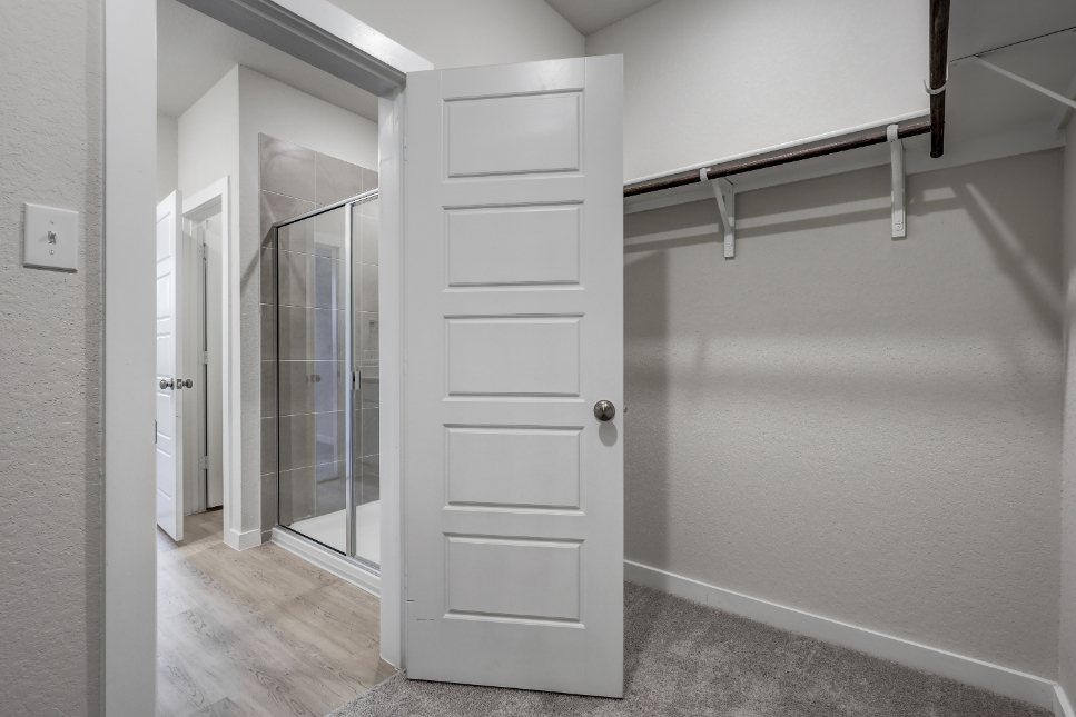 A white closet in a room.
