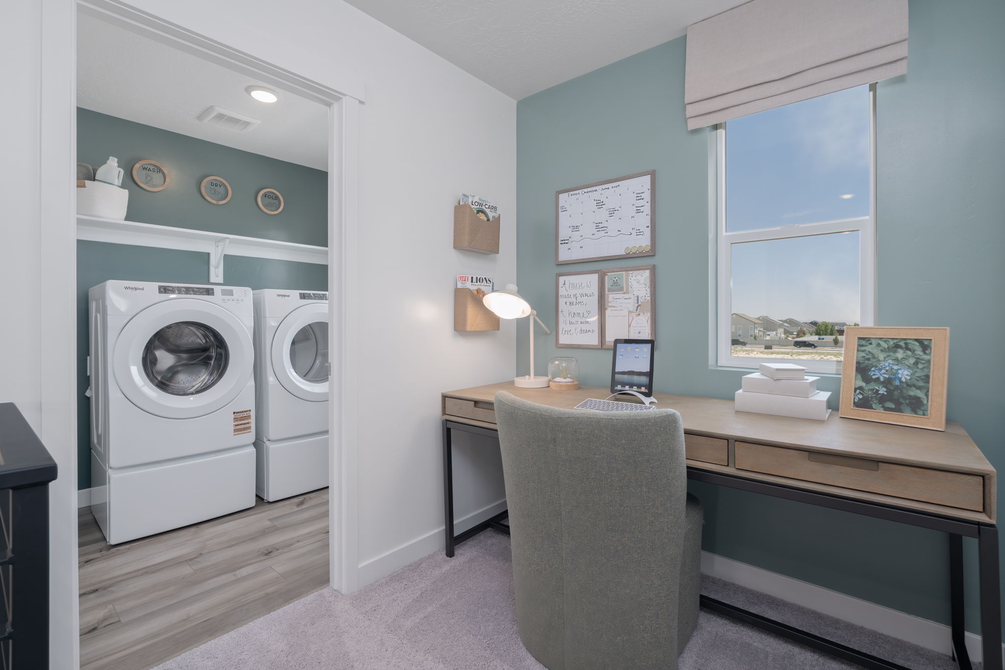 A room with a washer and dryer.