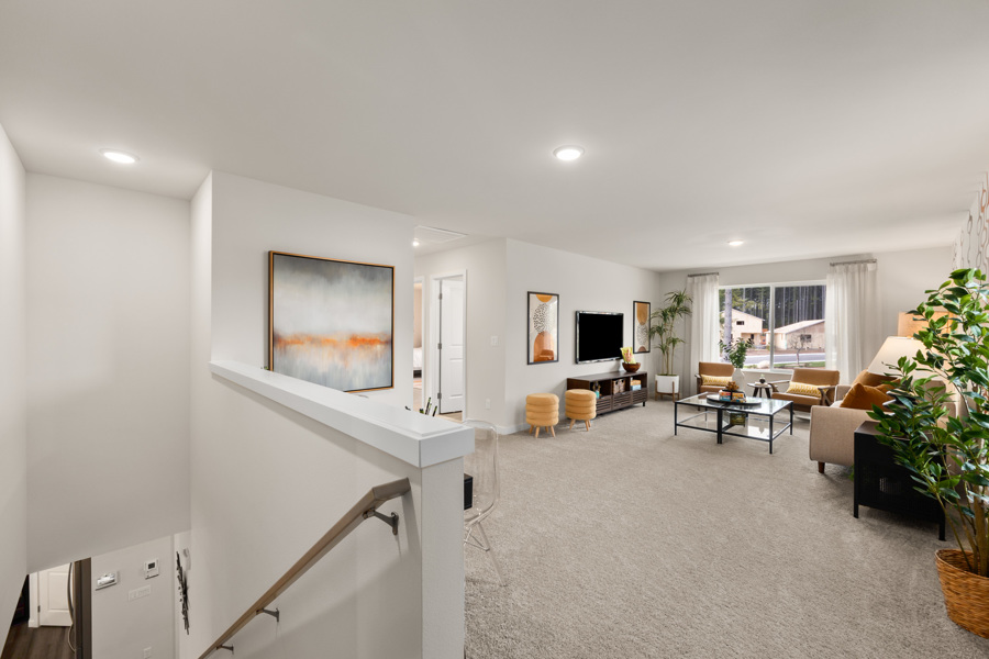 A living room with a staircase.