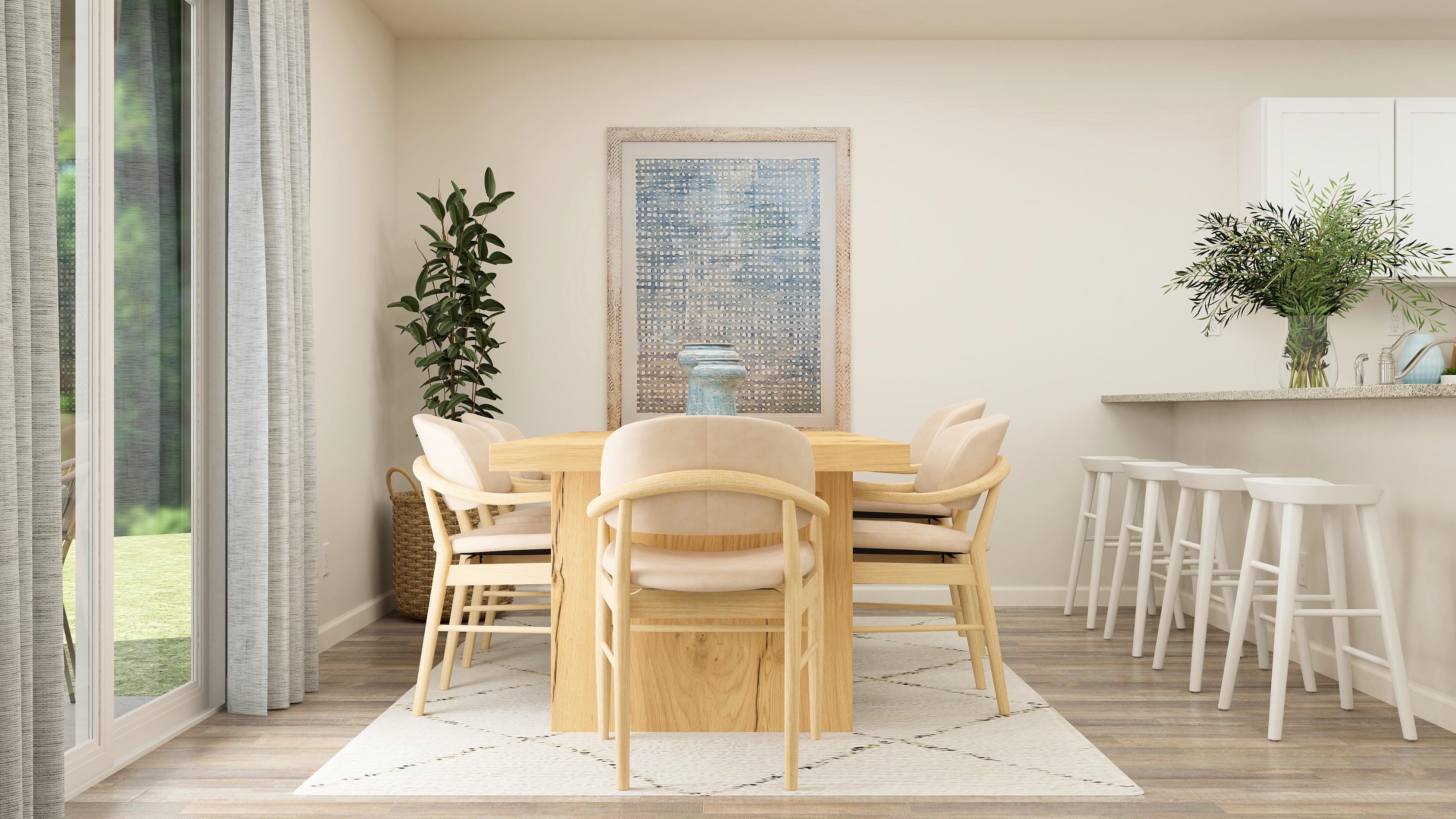 A dining room table with chairs around it.