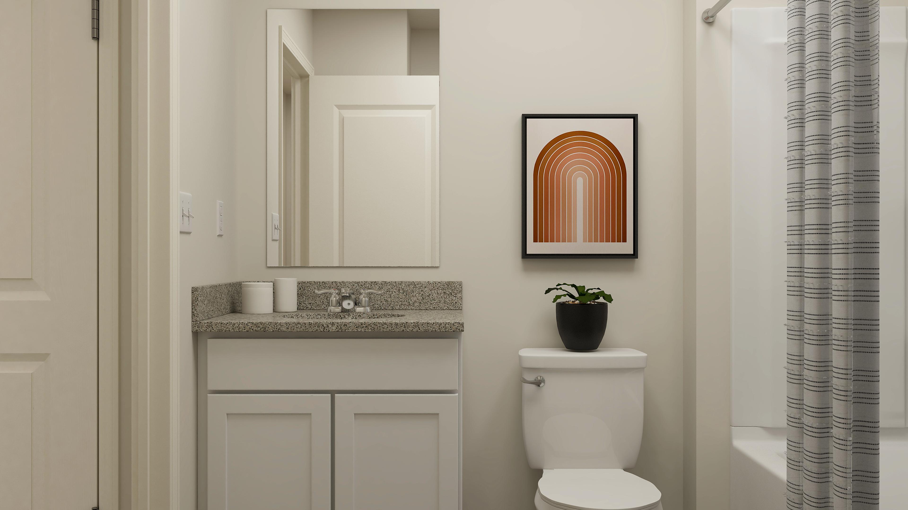 A bathroom with a toilet and a sink.