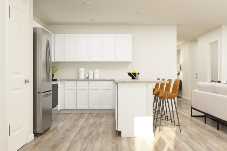 A kitchen with white cabinets.