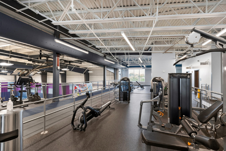 A gym with exercise equipment.