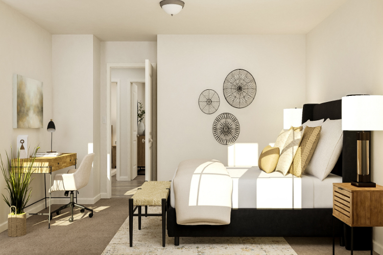 A room with a couch and chairs.