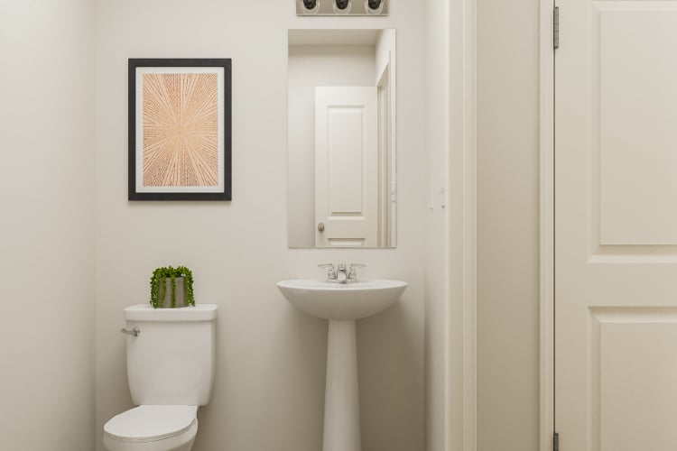 A bathroom with a sink and toilet.