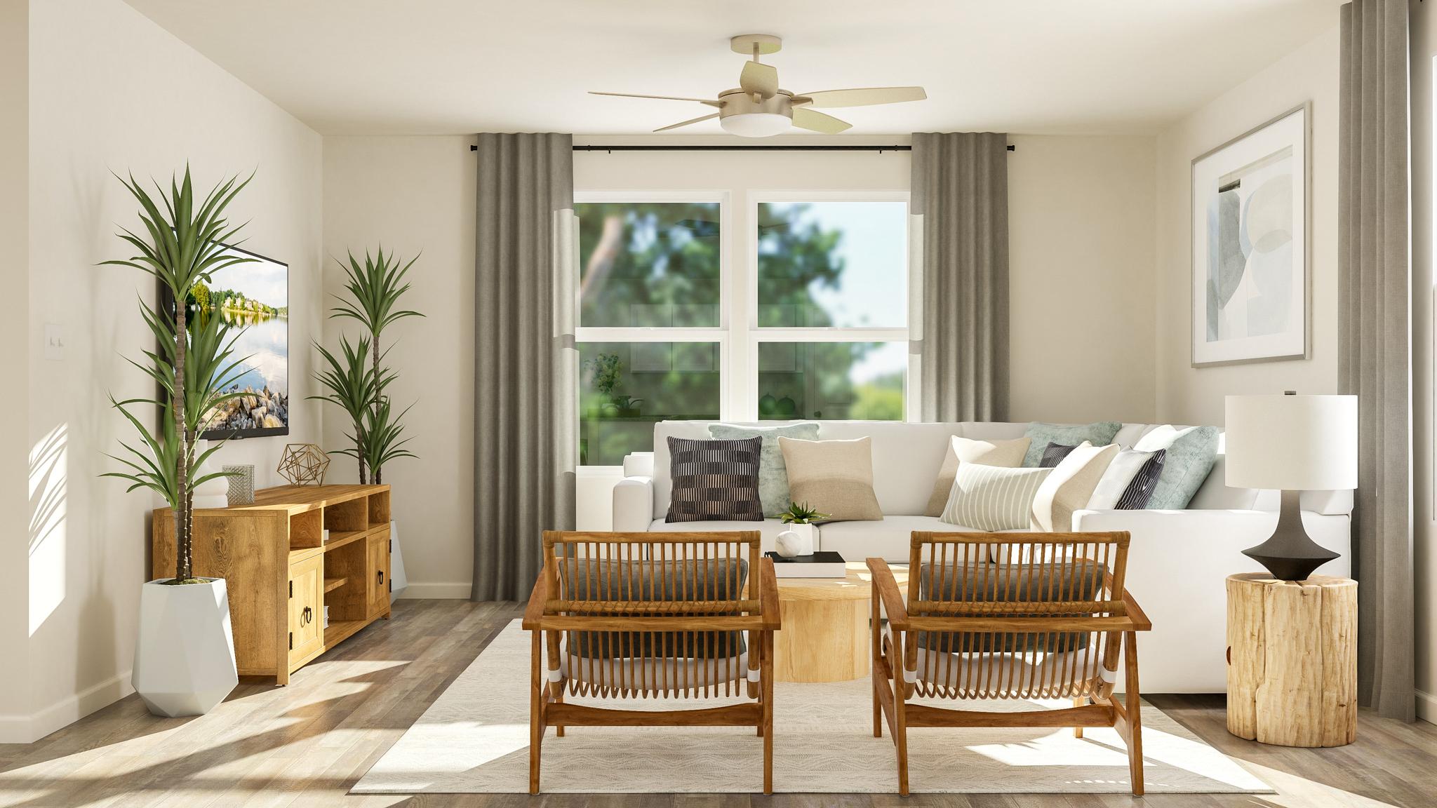 A living room with a white couch and a table.