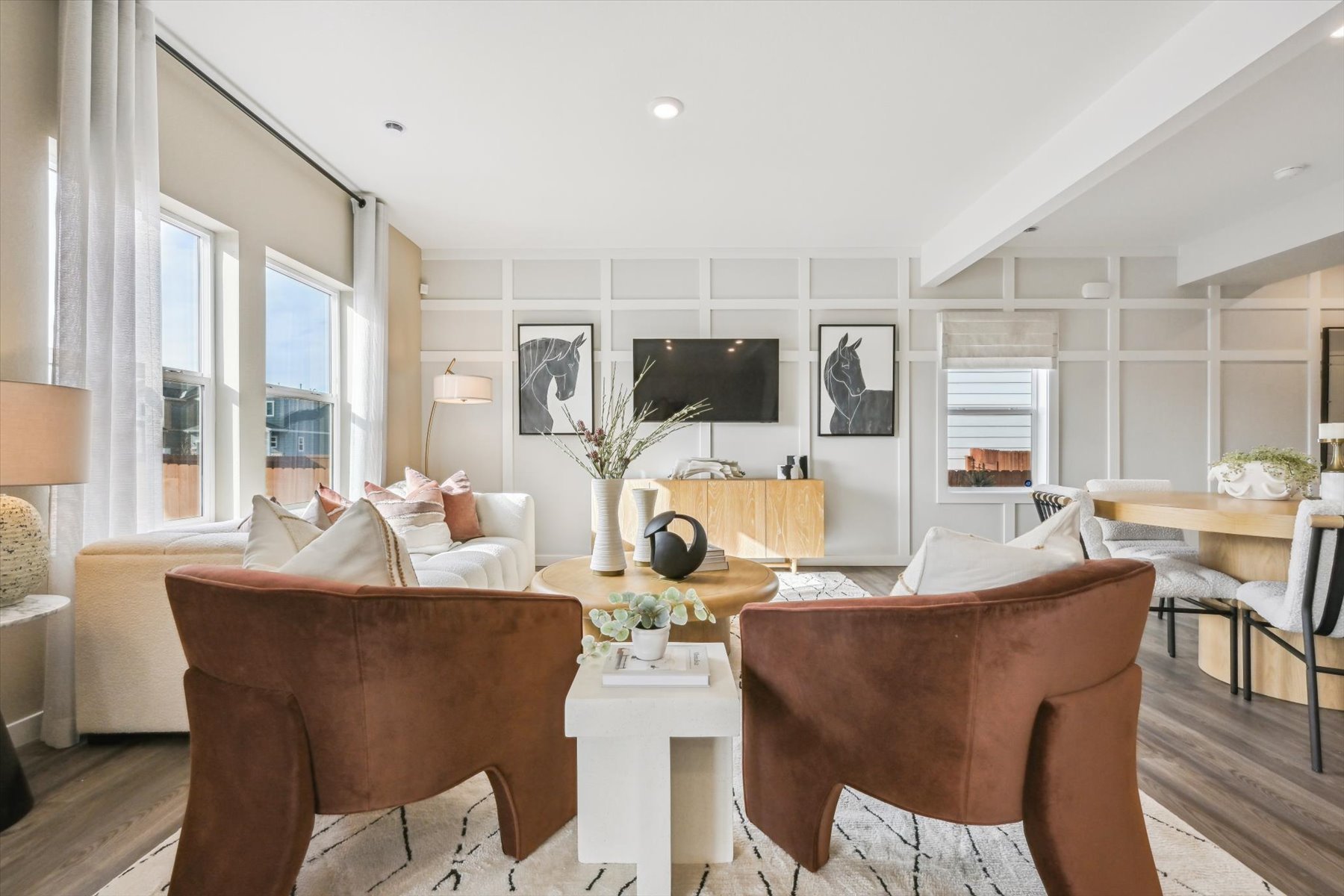 A living room with a couch and chairs.